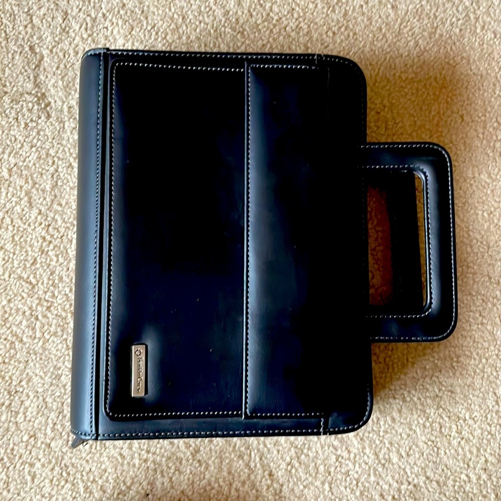 Black faux leather Franklin Covey planner with handles